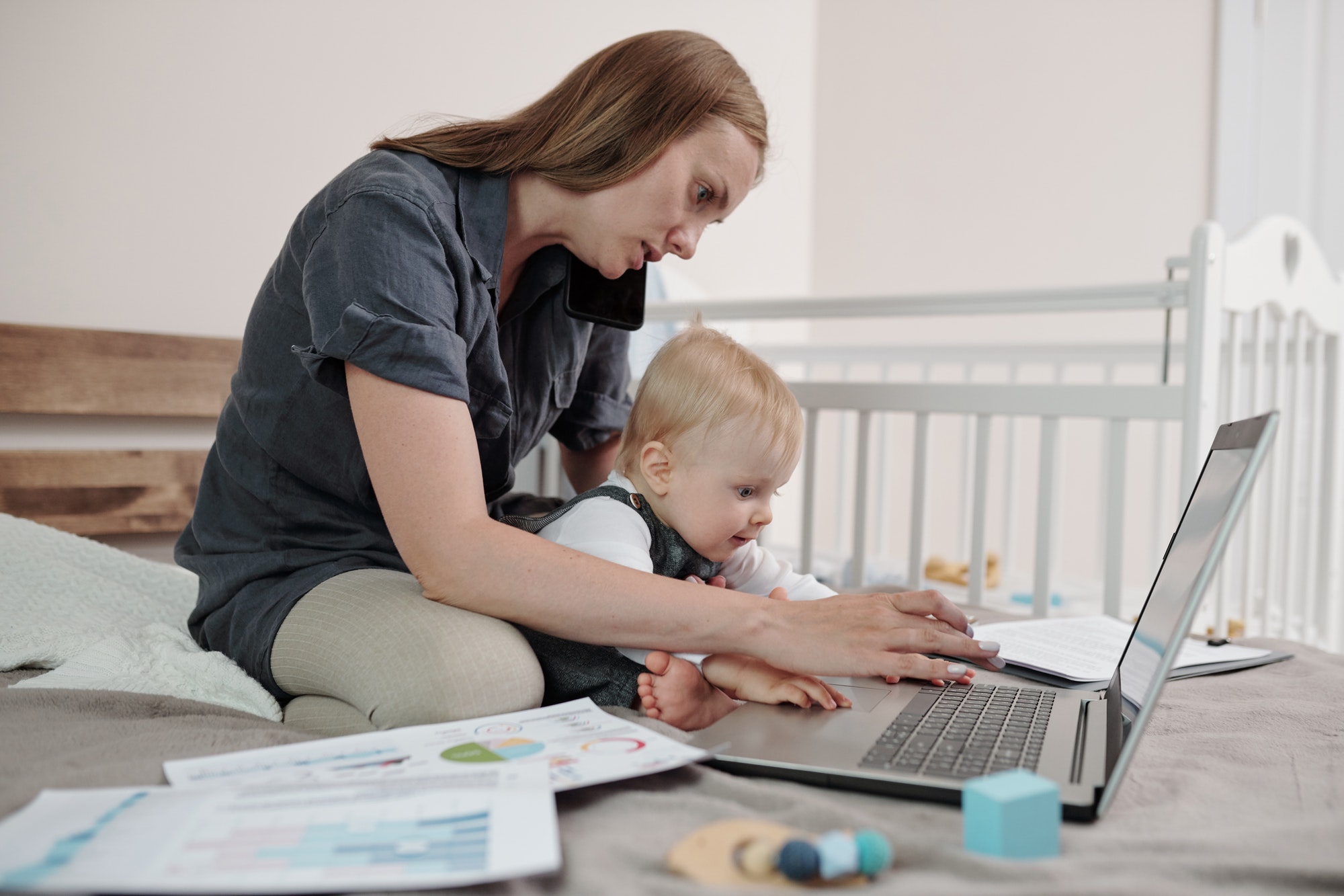 Young Mother Working At Home
